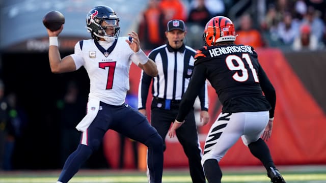 Houston Texans quarterback C.J. Stroud (7) throws under pressure from Cincinnati Bengals defensive end Trey Hendrickson (91) in the second quarter of a Week 10 NFL football game between the Houston Texans and the Cincinnati Bengals, Sunday, Nov. 12, 2023, at Paycor Stadium in Cincinnati.